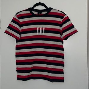 red, black, and white HUF worldwide tshirt